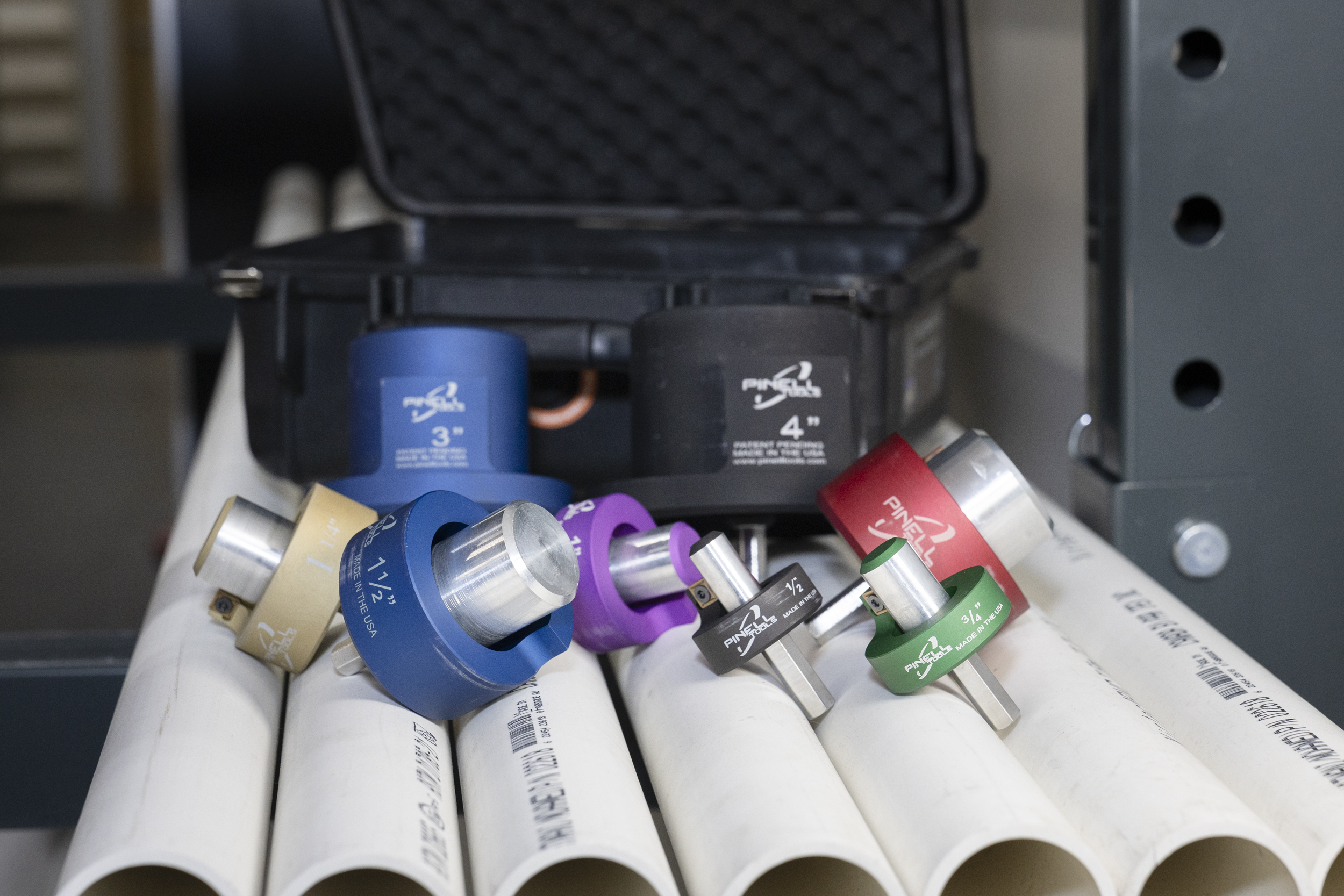 Artistic photo of Pinell tools on PVC pipe